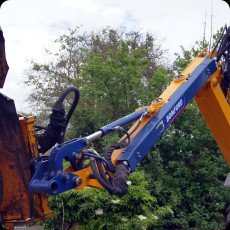 Closeup of the saw - extended hydraulic arm